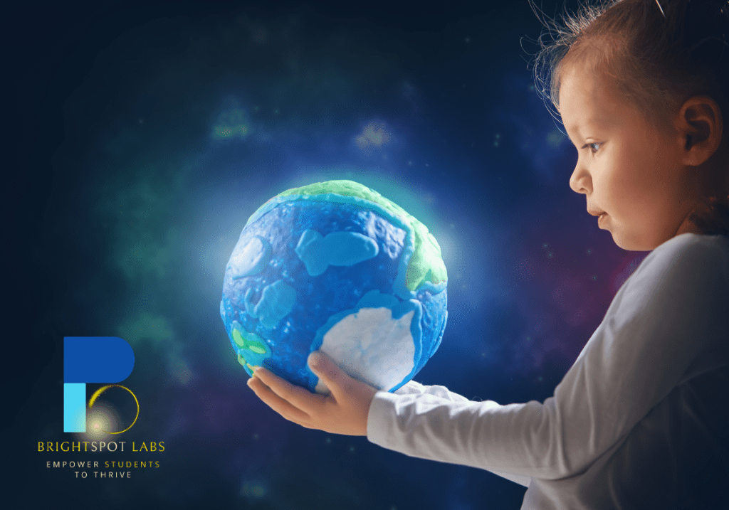 Young girl holding the earth representing BrightSpot Labs education consulting mission to empower every child