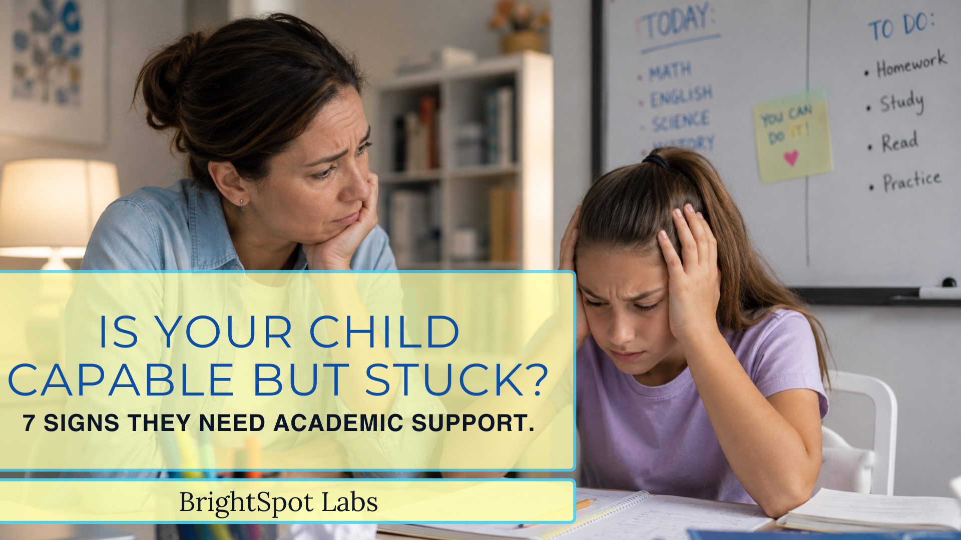 Parent sitting with a frustrated child at a homework desk, representing signs a child needs academic support